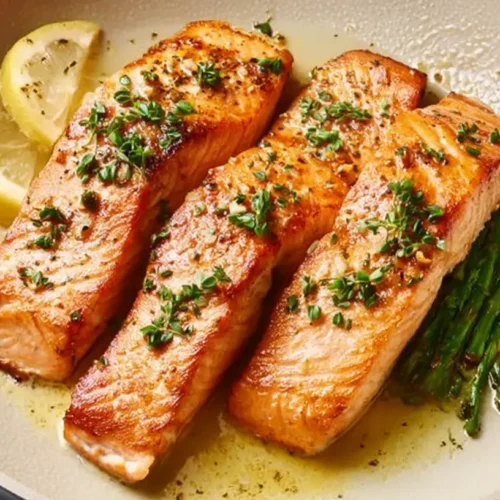 Easy Pan Seared Salmon Recipe: 7 Tips for Success 2 A perfectly cooked pan seared salmon fillet on a white plate.
