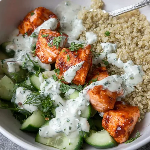 Healthy Salmon and Quinoa Bowl: 10 Reasons to Try It 2 A vibrant healthy salmon and quinoa bowl with fresh vegetables.