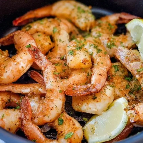 Quick Lemon Shrimp: The 1 Secret Ingredient 2 A platter of quick lemon shrimp, perfectly cooked and seasoned.