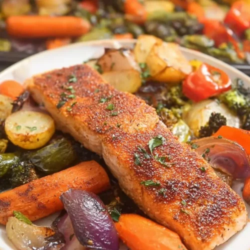 Salmon and Vegetable Sheet Pan Meal: 1 Delicious Dinner 2 A colorful Salmon and Vegetable Sheet Pan Meal with roasted salmon fillets and mixed vegetables.