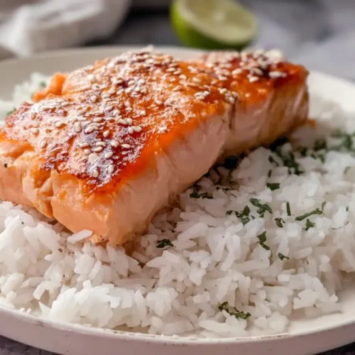 Simple Salmon with Rice: The 3 Best Ways to Serve It 2 A serving of simple salmon with fluffy white rice on a plate
