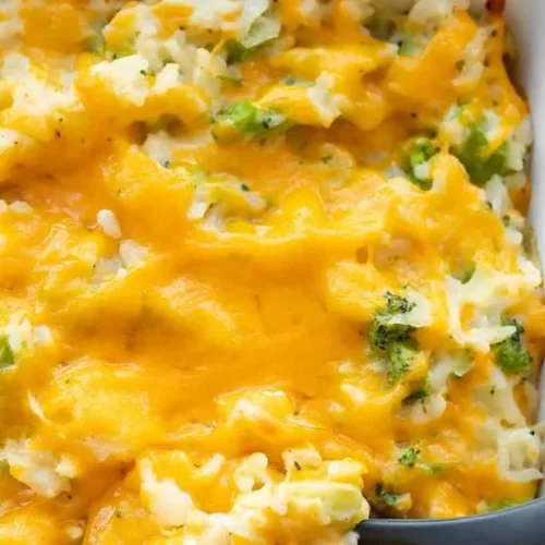 Broccoli Cheese Casserole: 2 A bubbling broccoli cheese casserole fresh from the oven, showing golden-brown topping and green florets.