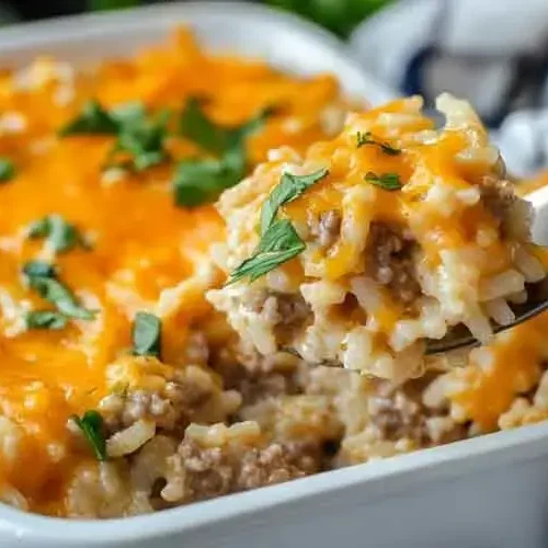 Cheesy Hamburger Casserole: Our #1 Weeknight Meal 2 A bubbling cheesy hamburger casserole in a baking dish, fresh from the oven