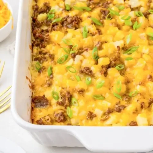 A baked Family Favorite Make Ahead Breakfast Casserole in a dish, ready to serve.