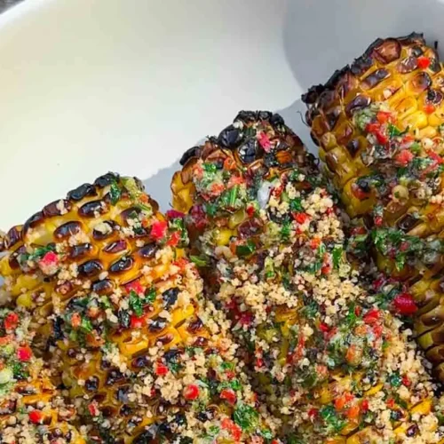Grilled corn on the cob seasoned with a vibrant chili lime rub
