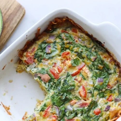 A healthy breakfast casserole loaded with colorful vegetables, ready to serve.