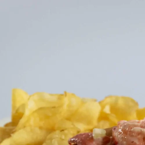 A New England lobster roll, served cold on a buttered and toasted bun, filled with fresh lobster meat