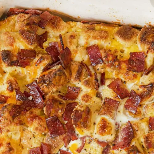 A steaming nutritious breakfast casserole dish, fresh from the oven.