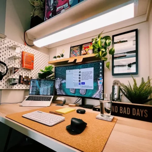 A clean and organized student desk setup with a laptop and books.