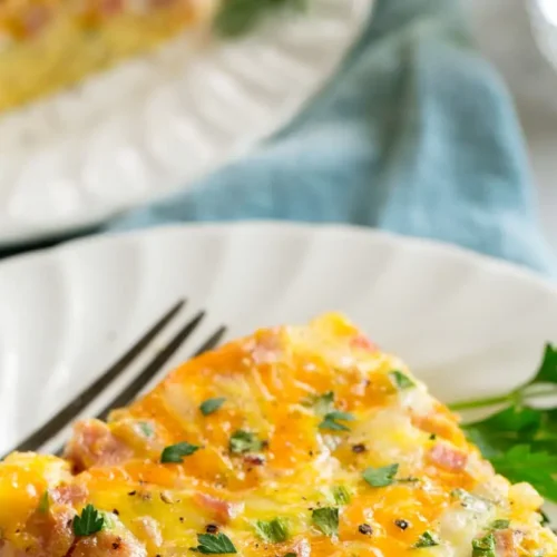 A freshly baked weekday breakfast casserole in a baking dish, ready to serve.