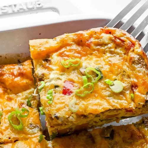 A freshly baked wholesome breakfast casserole, steaming hot and ready to serve.